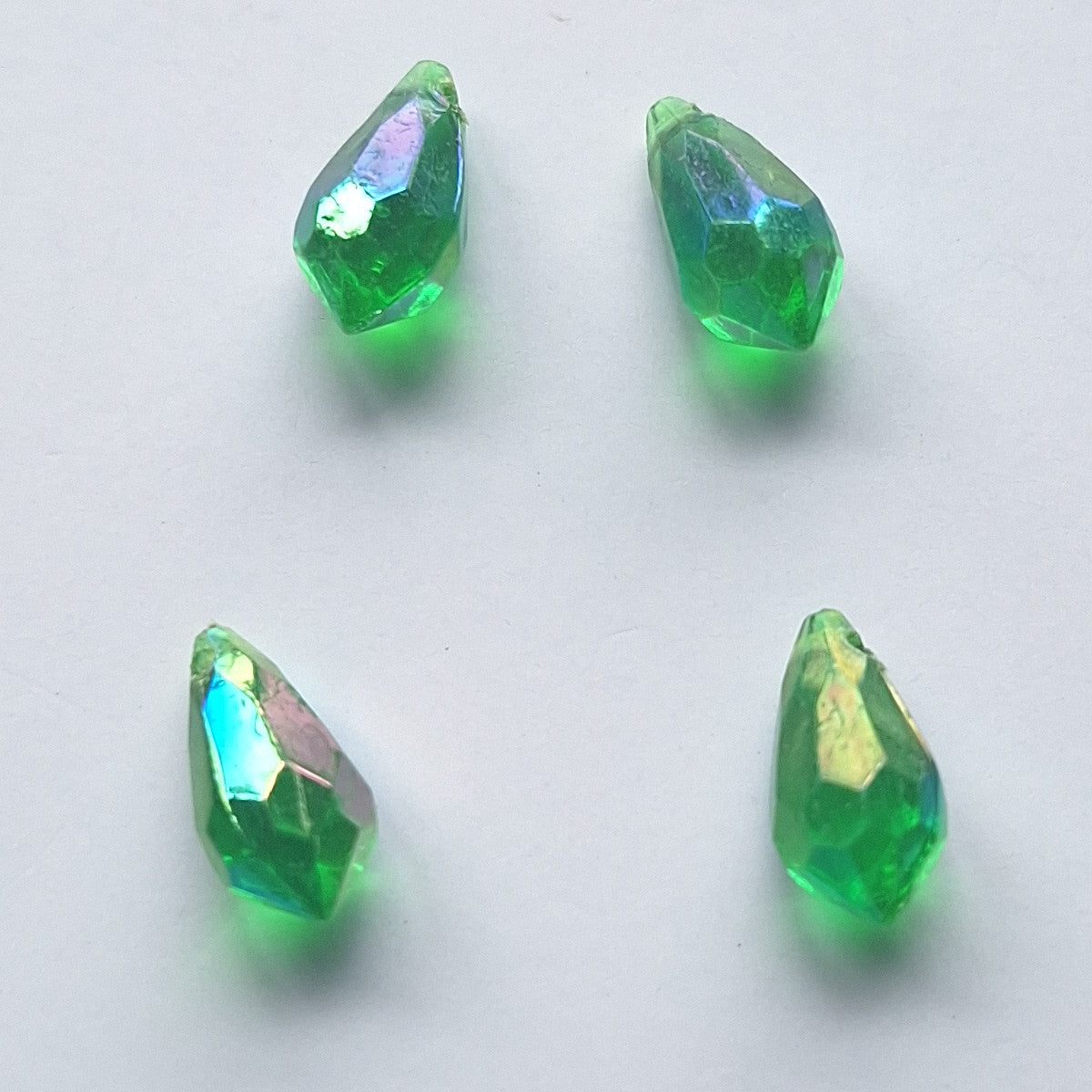 Four AB faceted plastic drop in Emerald, translucent, sew-on, 6.5x13mm.