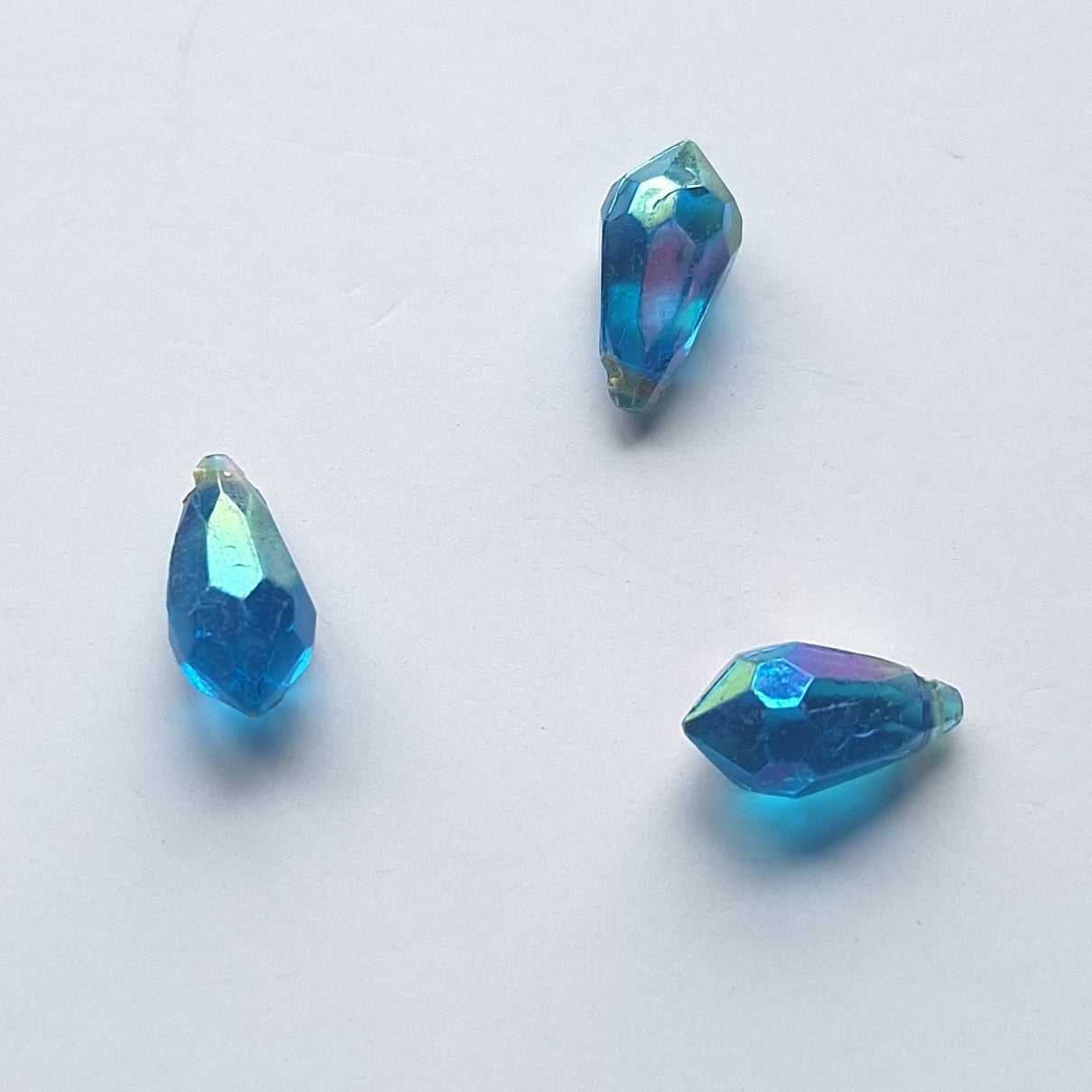 Three AB faceted plastic drop in Blue, translucent, sew-on, 6.5x13mm.