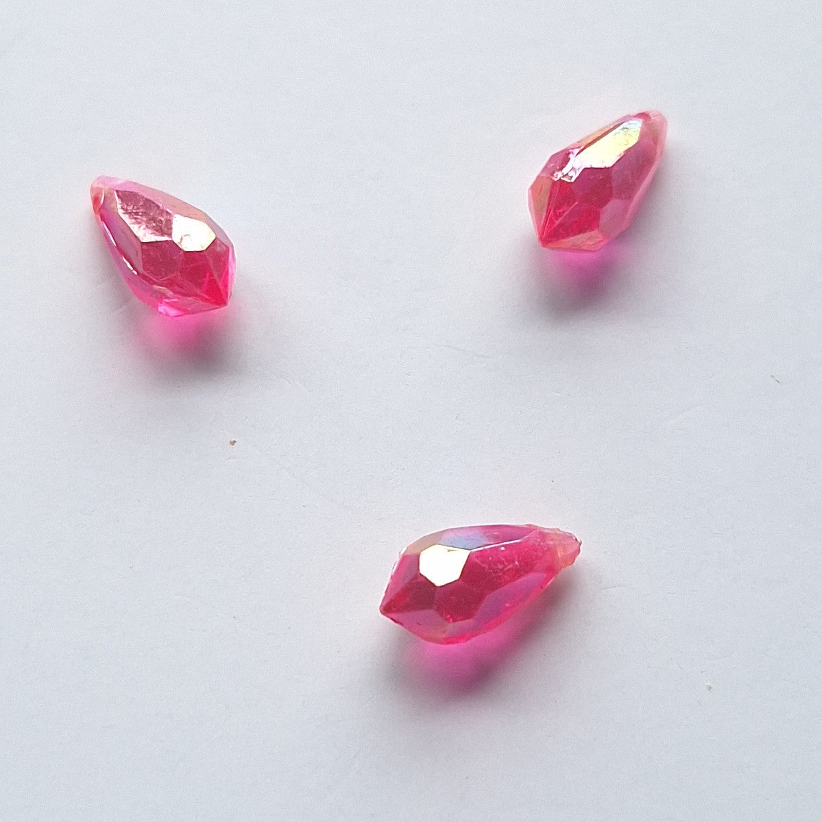 Three AB faceted plastic drop in Magenta, translucent, sew-on, 6.5x13mm.
