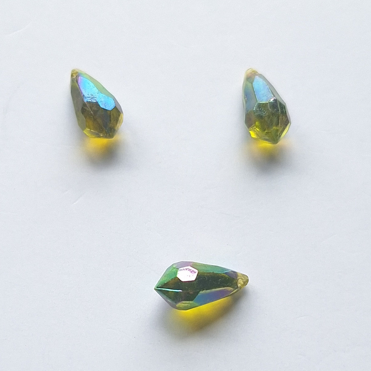 Three AB faceted plastic drop in Olive, translucent, sew-on, 6.5x13mm.