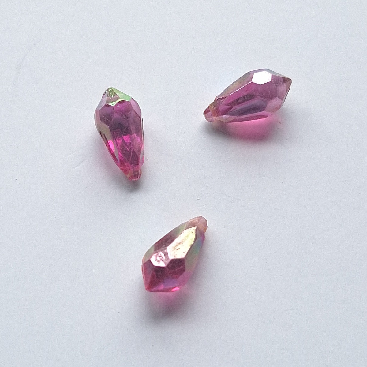 Three AB faceted plastic drop in Violet, translucent, sew-on, 6.5x13mm.