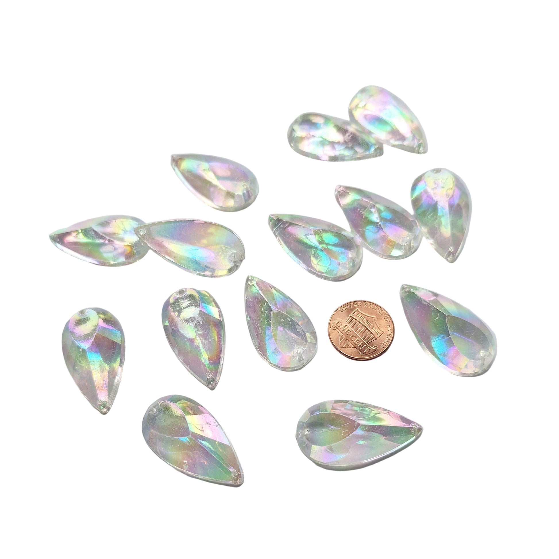 Crystal AB teardrop cabochons shown together, with a penny for scale.