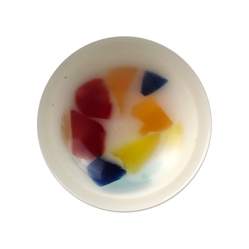 White plastic button with multicolor confetti specks and a domed shape in size 18mm/28L.