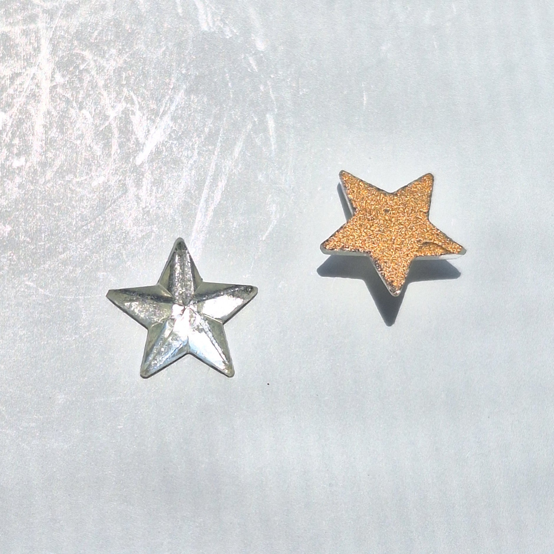Crystal 10 mm mirrored glass star cabochon shown front and back.