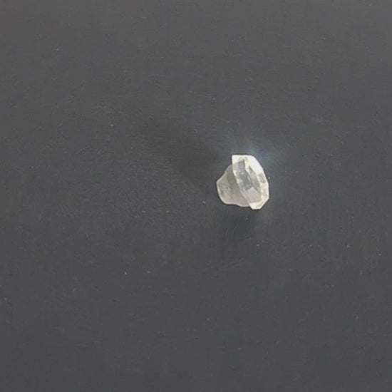 Mirrored glass button with 8-sided shape and raised perimeter edge, 11.4mm, , shown in video with light movement to display the mirrored finish and back.
