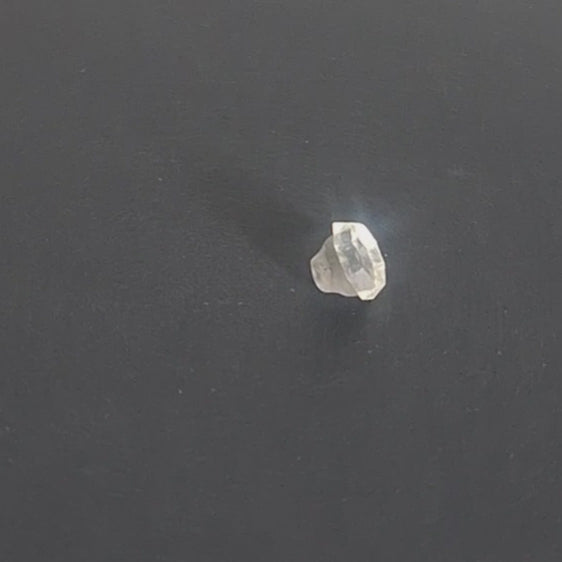 Mirrored glass button with 8-sided shape and raised perimeter edge, 11.4mm, , shown in video with light movement to display the mirrored finish and back.