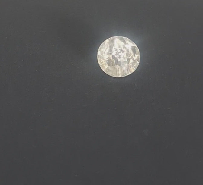 Faceted clear mirrored glass button with irregular rocky, diamond-like surface and pointed profile, channel shank, 14mm/22L, shown in video with light movement to display the mirrored finish and back.