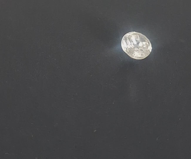 Mirrored glass button with concave form and beveled top edge, 11.4mm, , shown in video with light movement to display the mirrored finish and back.