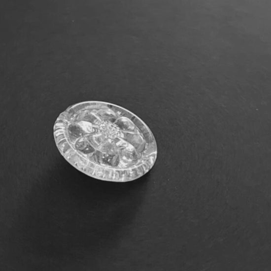 Mirrored glass button with swirl design, 29mm shown in video with light movement to display the mirrored finish.