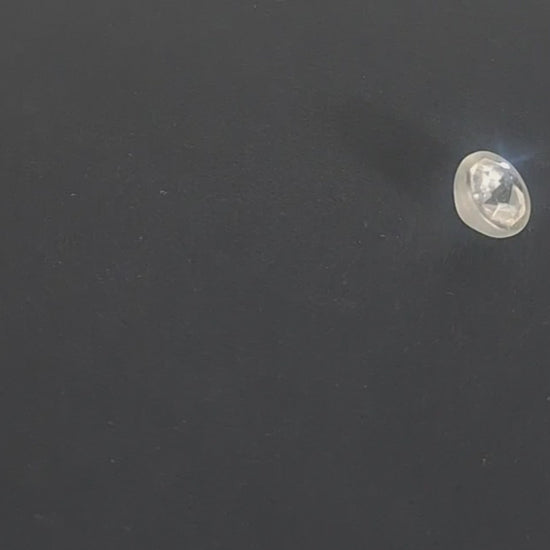 Mirrored glass button with faceted octagonal center set in frosted shell, 14mm, , shown in video with light movement to display the mirrored finish and back.