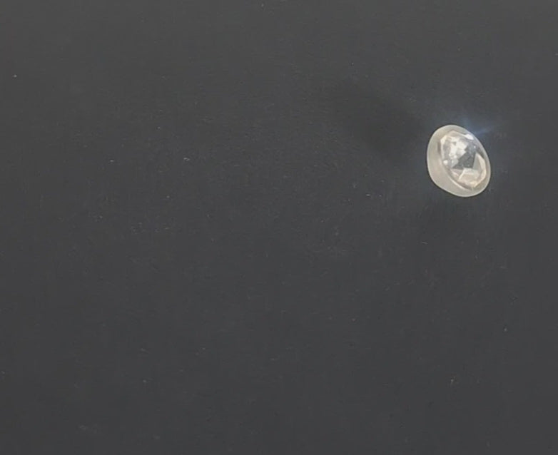Mirrored glass button with faceted octagonal center set in frosted shell, 14mm, , shown in video with light movement to display the mirrored finish and back.