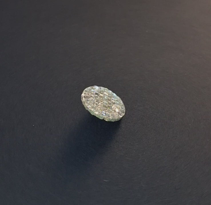Mirrored glass button with pebbled textured surface and shank attachment, 18mm, shown in video with light movement to display the mirrored finish.