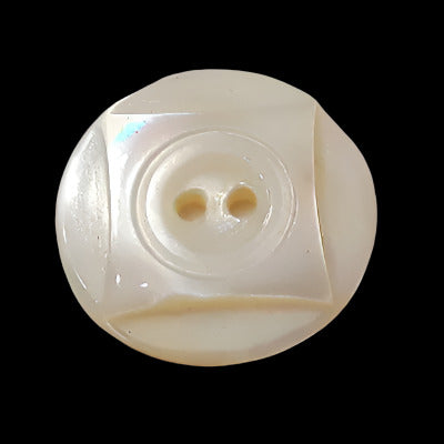 Front view of carved freshwater shell button with raised square design and two-hole center, 18mm size.
