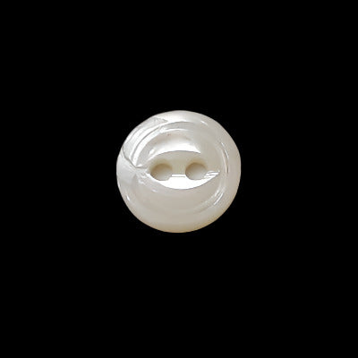 Front view of 9mm troca shell button showing fisheye contour and recessed two-hole center.