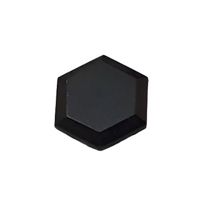 Black 8×9 mm thin flat hexagonal glass cabochon with table-cut mirror finish on a neutral background